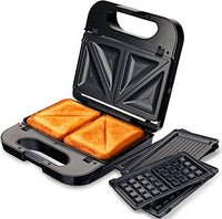 Grunkel - Sandwichera con placas intercambiables (2 sandwiches con corte, grill y 2 gofres). Superficie antideslizante y antiadherente de 850W de potencia y tacto frío. Color acero inoxidable.