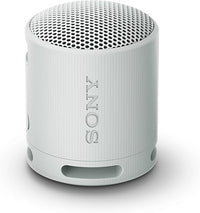 Sony Altavoz Bluetooth SRS-XB100, Ligero, Compacto, Altavoz Resistente al Agua y al Polvo IP67, hasta 16 h de batería, Correa Adaptable, Gris Claro